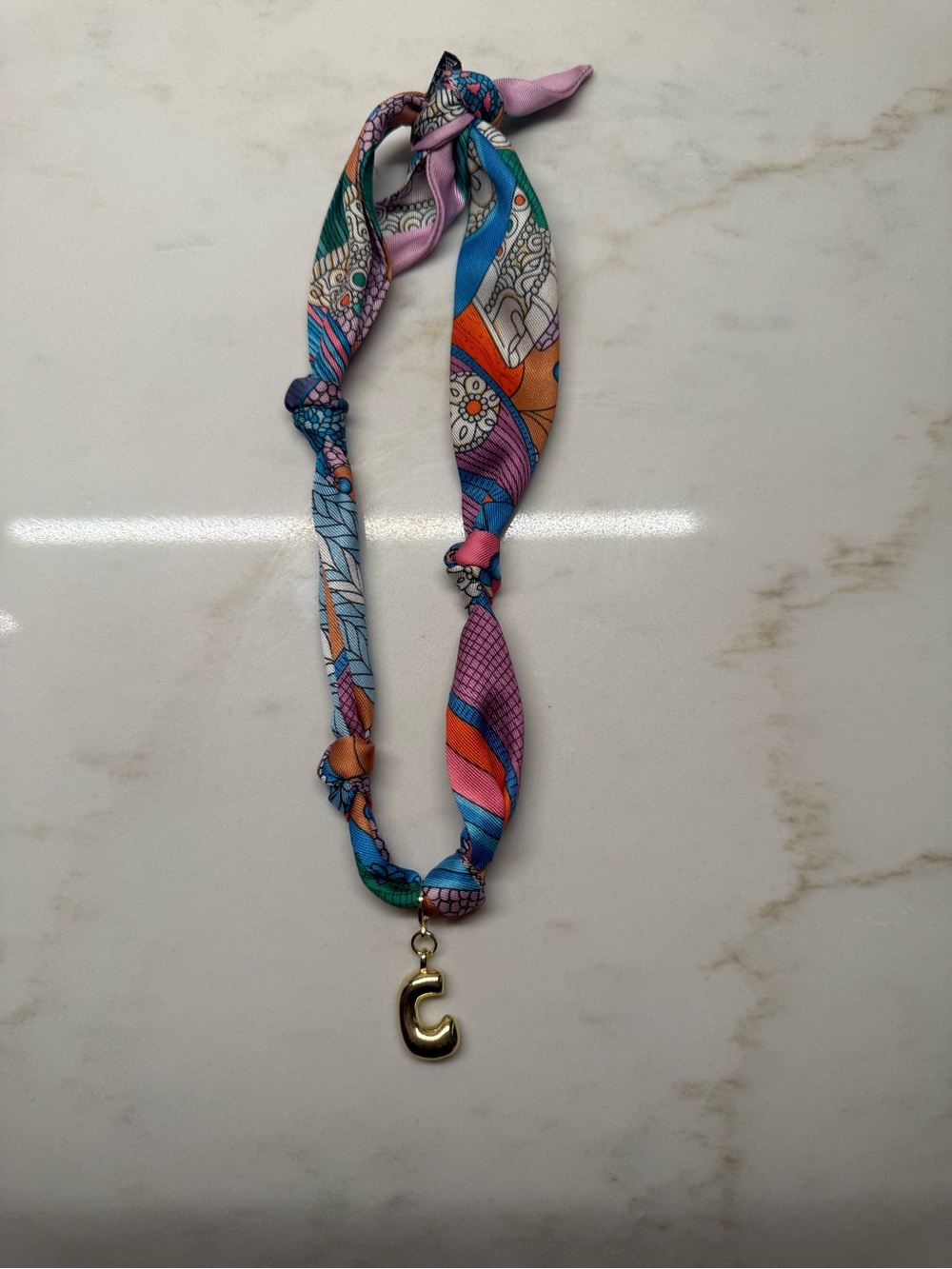 ETTA & EAST - Multicolor Patterned Silk Scarf Necklace with Gold 'C' Charm